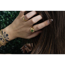 Oval Tsavorite Signet Ring With Burnished Diamond Accents