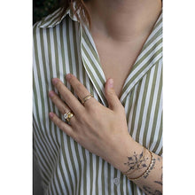 Two-Tone Wide Band with Tilted Pear Shape Diamonds